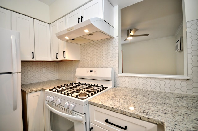 kitchen with white appliances, light stone countertops, ceiling fan, white cabinetry, and backsplash