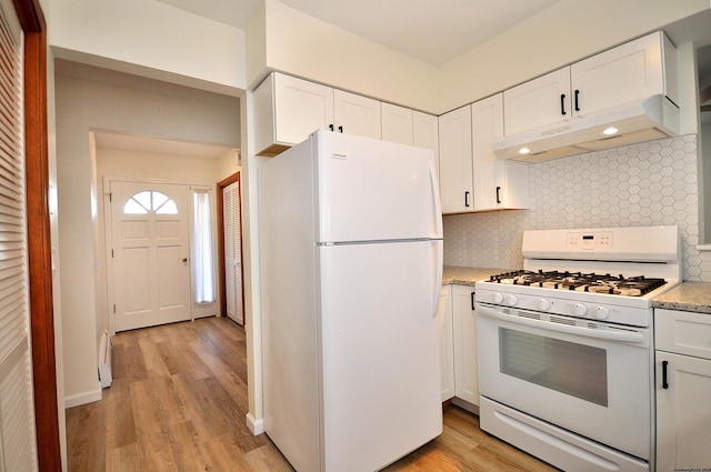 kitchen featuring white appliances, white cabinetry, and tasteful backsplash