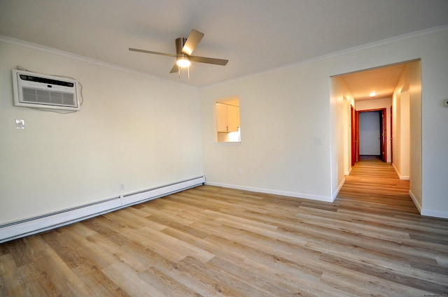 empty room with ornamental molding, baseboard heating, and light wood-type flooring