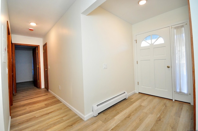 foyer featuring a baseboard radiator and light hardwood / wood-style flooring