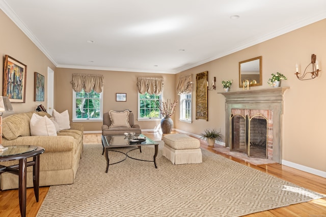 living room featuring crown molding, light wood-type flooring, and a fireplace