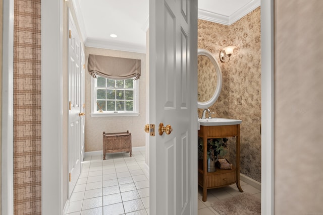 bathroom featuring crown molding, tile patterned flooring, and sink