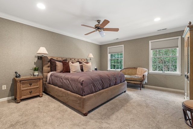 bedroom featuring ceiling fan, ornamental molding, and multiple windows