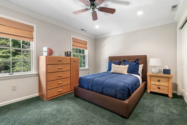 carpeted bedroom featuring ceiling fan and ornamental molding