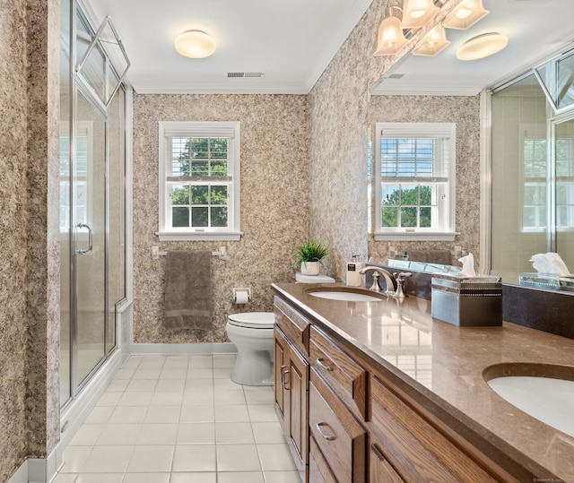 bathroom with walk in shower, vanity, crown molding, tile patterned flooring, and toilet