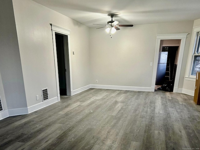 spare room featuring ceiling fan and wood-type flooring