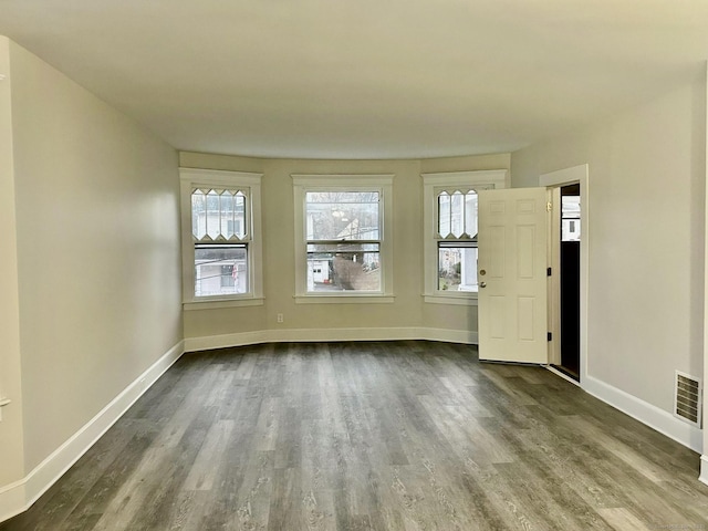 spare room featuring hardwood / wood-style floors