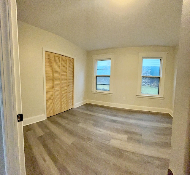 unfurnished bedroom featuring hardwood / wood-style flooring