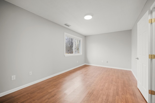 spare room with light hardwood / wood-style floors