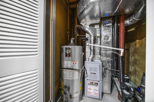 utility room featuring gas water heater