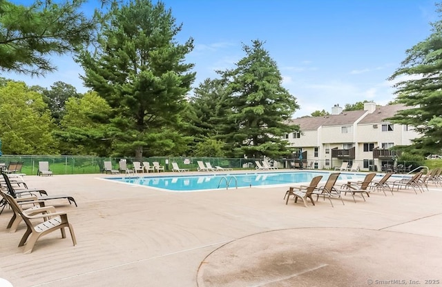 view of swimming pool with a patio area