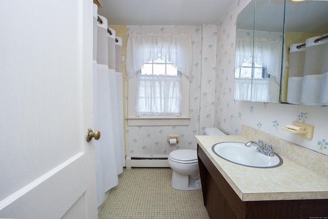 bathroom featuring tile patterned floors, vanity, toilet, and a baseboard radiator