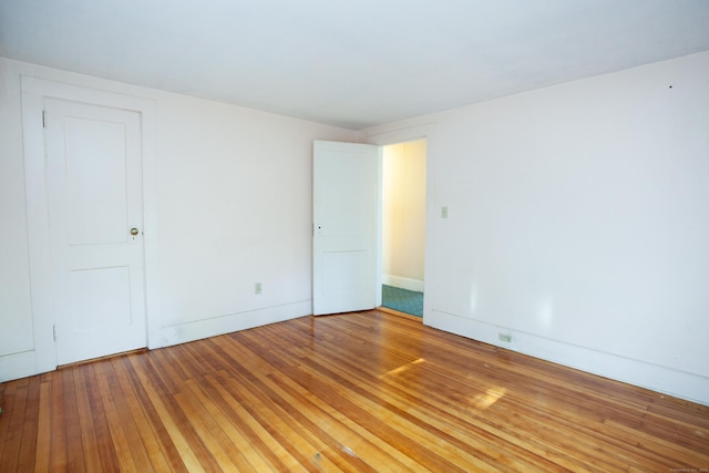 empty room with wood-type flooring