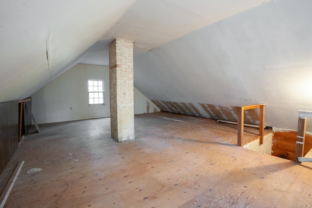 additional living space featuring lofted ceiling