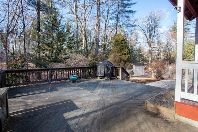 wooden terrace with a shed