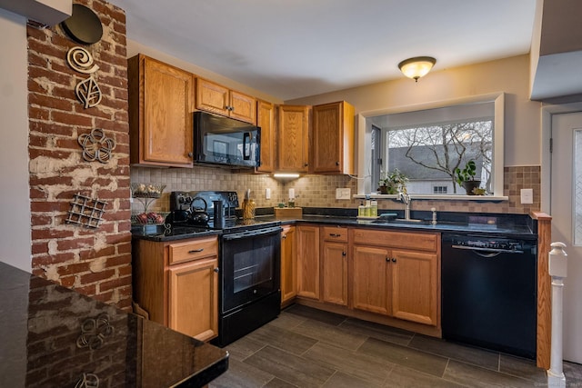 kitchen with black appliances, backsplash, and sink