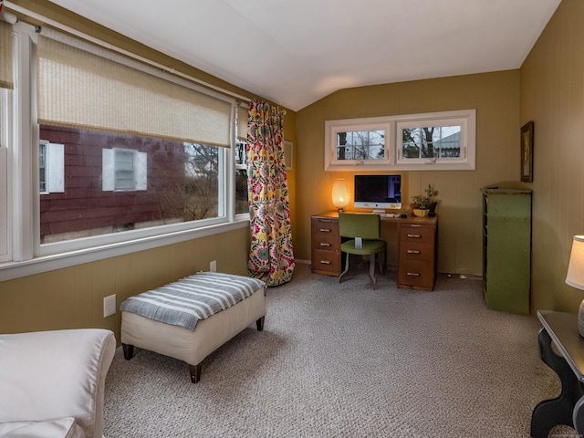 home office with carpet floors and vaulted ceiling