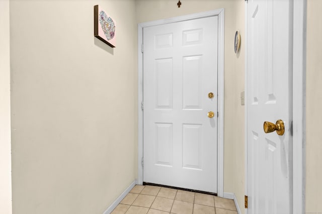 doorway featuring light tile patterned floors