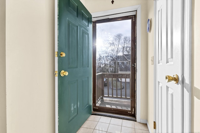 entryway with light tile patterned floors