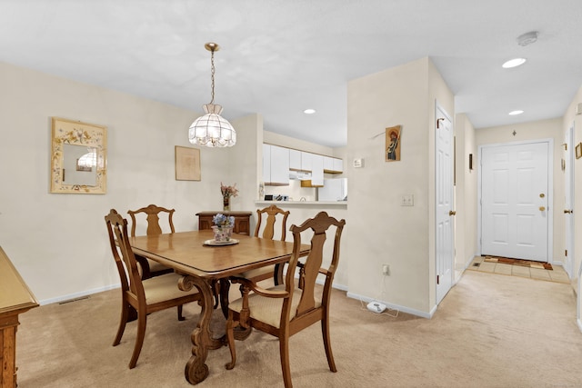 dining space with light carpet