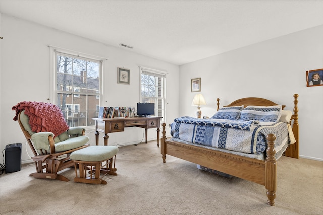 bedroom featuring light carpet