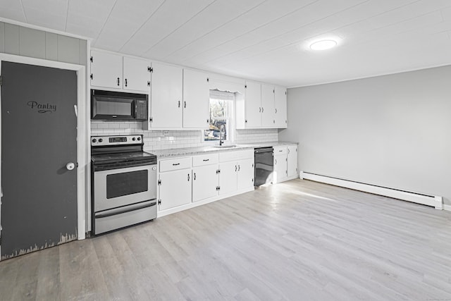 kitchen with black appliances, white cabinets, sink, and a baseboard heating unit