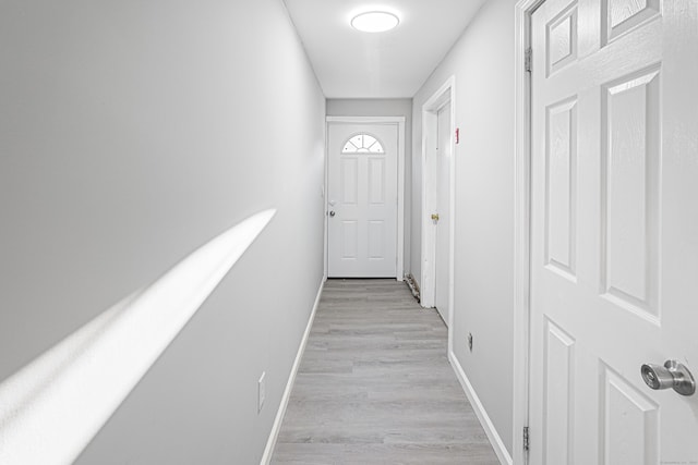 corridor featuring light hardwood / wood-style floors