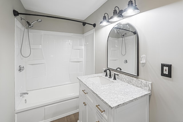 bathroom featuring hardwood / wood-style floors, vanity, and bathing tub / shower combination