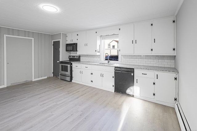 kitchen with sink, a baseboard heating unit, white cabinets, black appliances, and light wood-type flooring