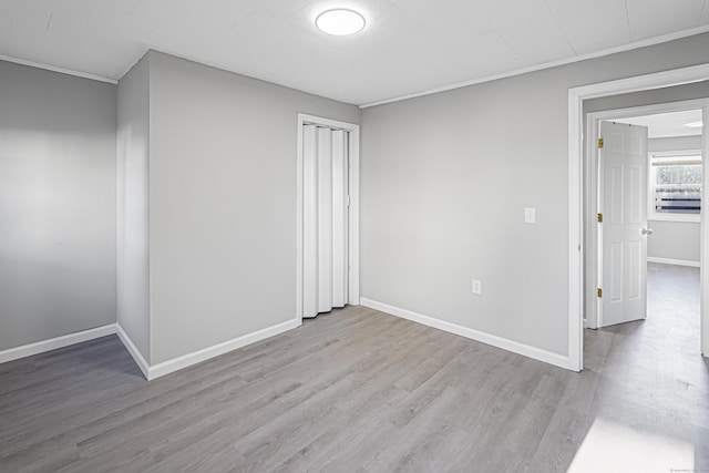 unfurnished room featuring light wood-type flooring