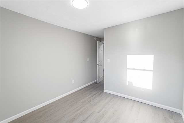 unfurnished room featuring light wood-type flooring