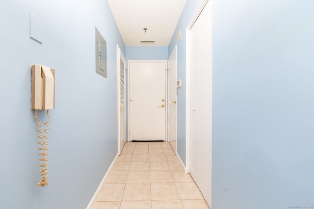 hallway with light tile patterned flooring