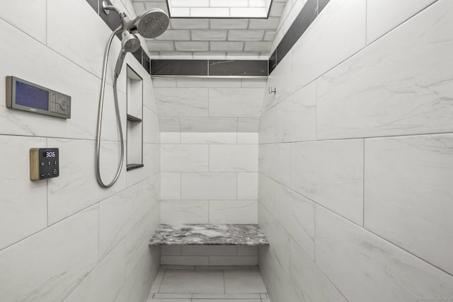 bathroom featuring tiled shower