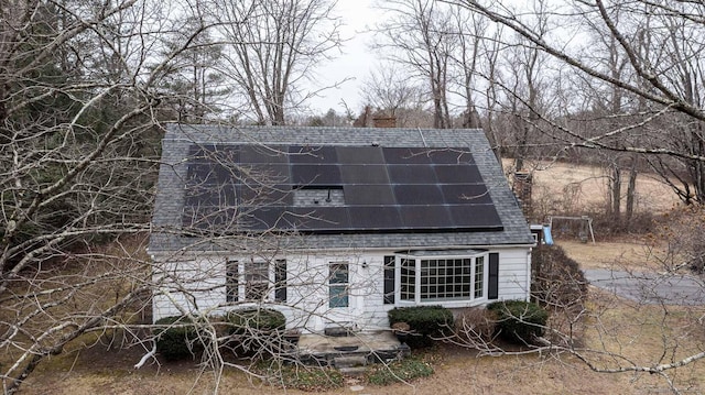 view of front of home featuring solar panels