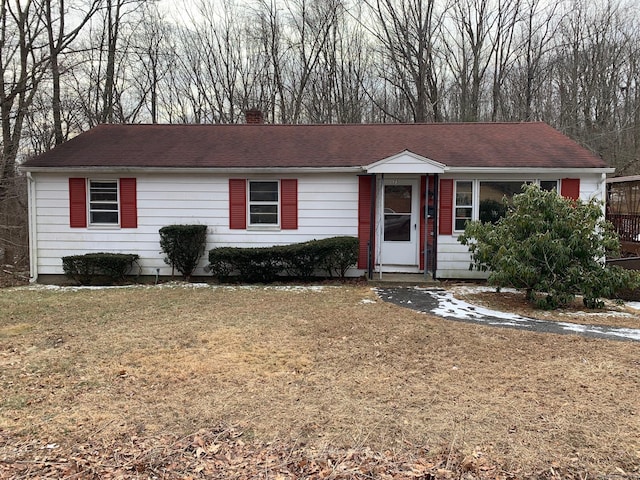 single story home featuring a front yard