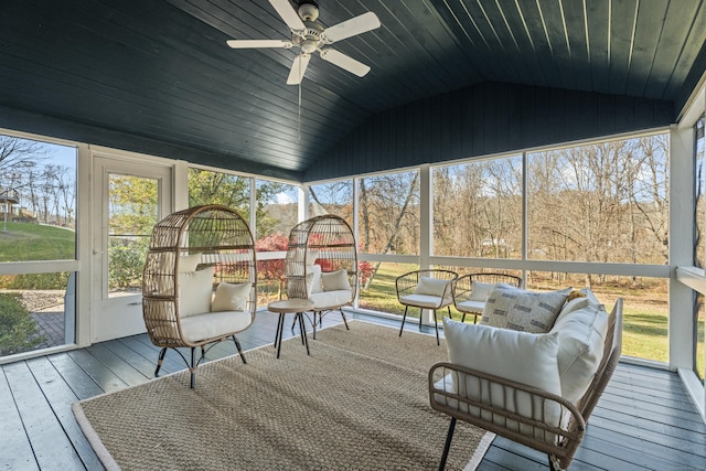 sunroom / solarium with ceiling fan and lofted ceiling