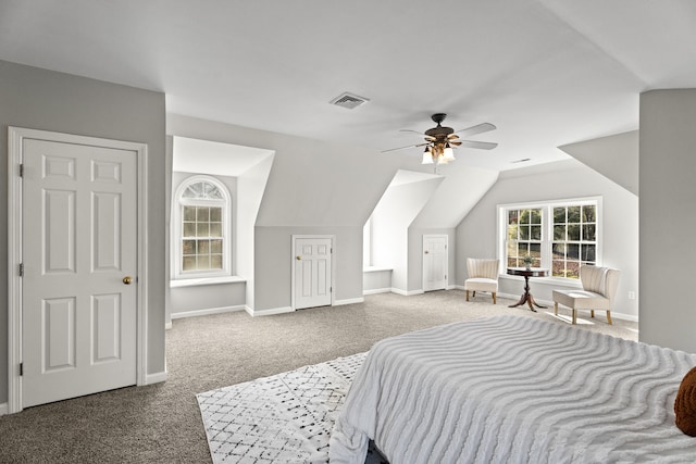 carpeted bedroom with ceiling fan and lofted ceiling