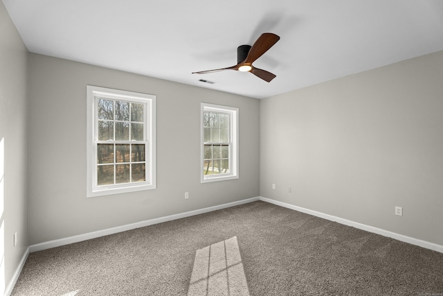 empty room featuring carpet and ceiling fan