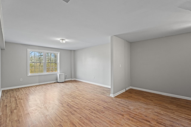 unfurnished room with light hardwood / wood-style floors