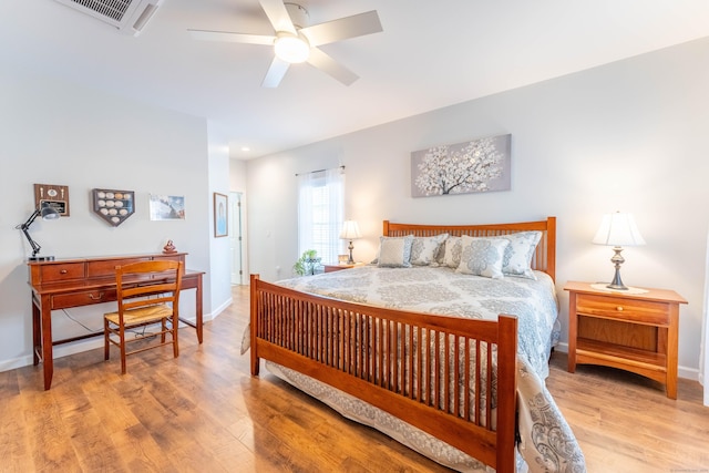 bedroom with ceiling fan and light hardwood / wood-style flooring