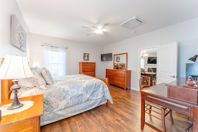 bedroom with ceiling fan and wood-type flooring