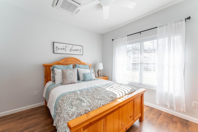 bedroom featuring multiple windows, ceiling fan, and dark hardwood / wood-style floors