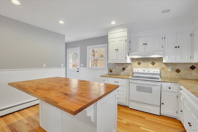 kitchen featuring a center island, white cabinets, white electric range, decorative backsplash, and butcher block counters