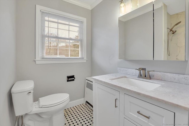 bathroom with ornamental molding, vanity, a shower, radiator heating unit, and toilet