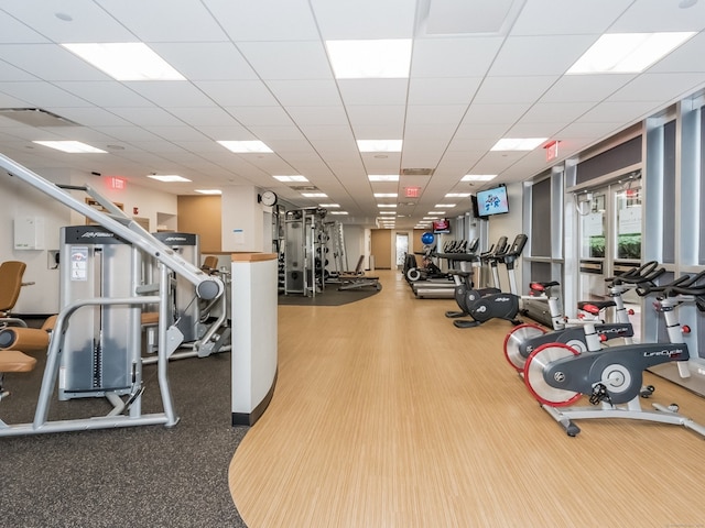 workout area featuring hardwood / wood-style floors