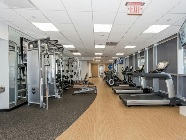 exercise room with hardwood / wood-style flooring