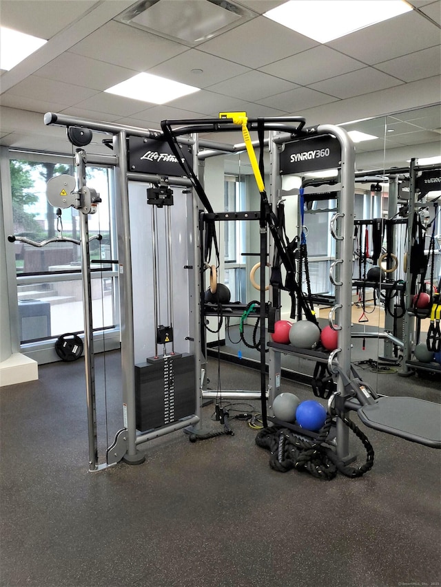 gym featuring a paneled ceiling