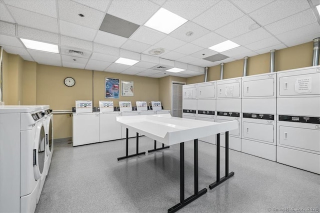 laundry room featuring washing machine and dryer and stacked washer / drying machine