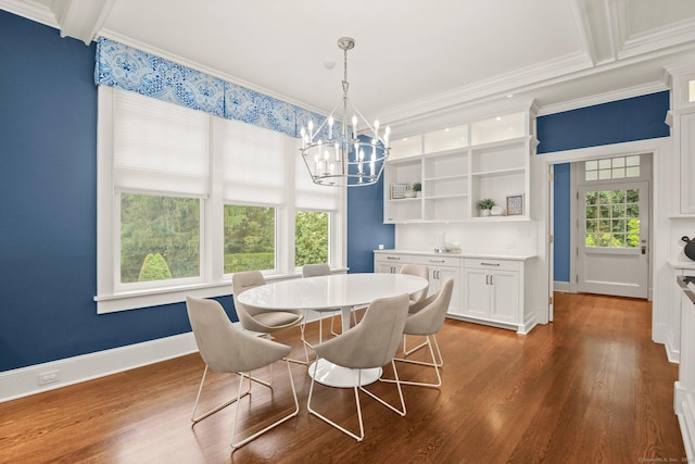 dining space featuring beamed ceiling, dark hardwood / wood-style floors, an inviting chandelier, and crown molding