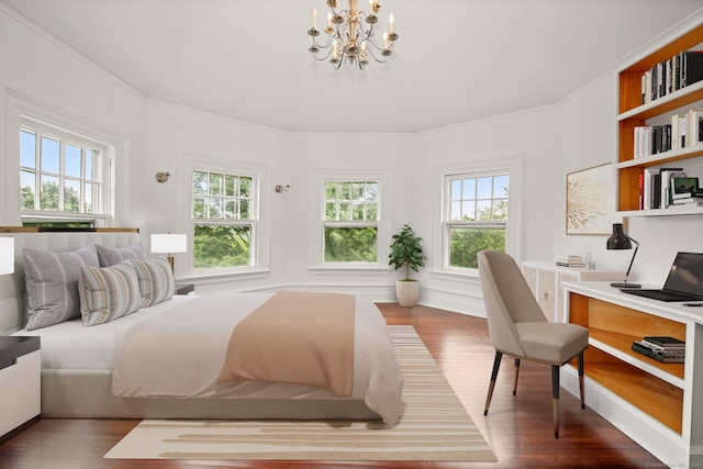 bedroom featuring wood-type flooring, ornamental molding, and a chandelier